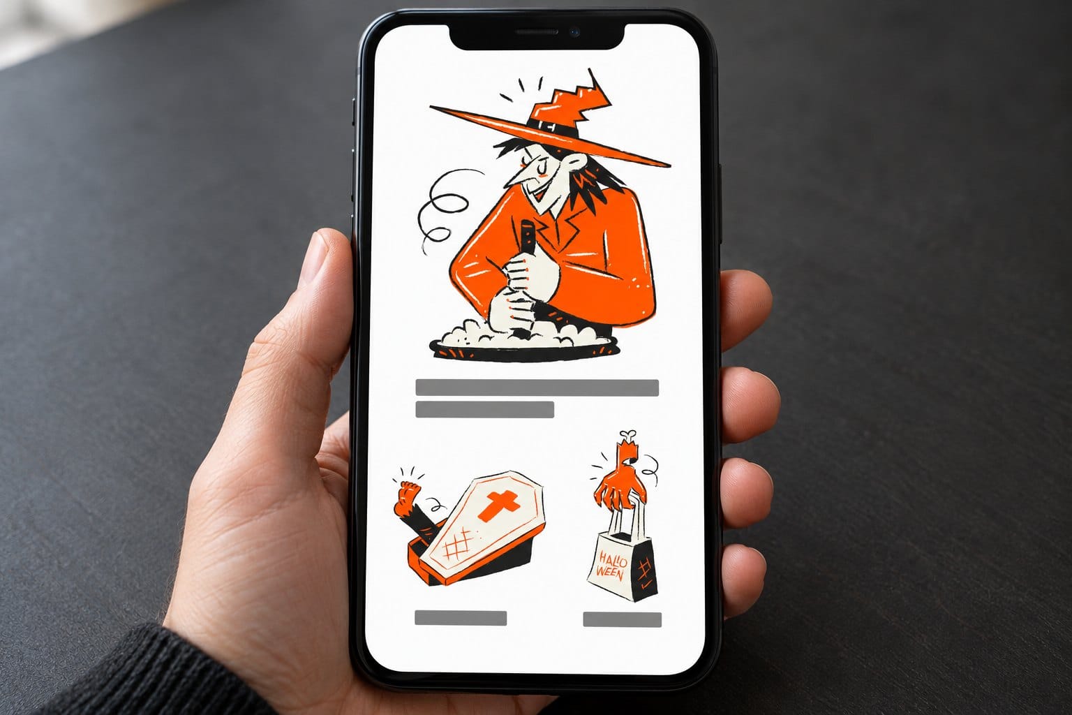 A hand holding a phone that shows a mockup Halloween newsletter: a witch in an orange hat and orange coat gripping a dark stick over a puff of smoke fills the top, grey bars stand in for the heading, then two small drawings side by side, a coffin with a foot kicking out and a clawed hand holding up a bag that reads Halloween